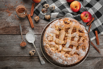 Composition with delicious apple pie on wooden table