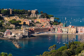 Fototapeta na wymiar The seafront and the beach of Sestri Levante, seen from distant surrounding hills