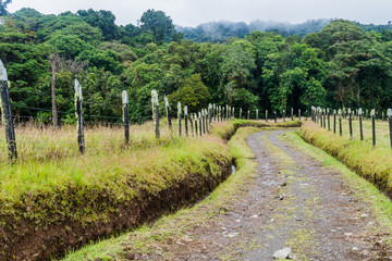Fototapeta na wymiar Small mountain road between pastures near Boquete, Panama.