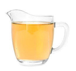 Glass jug with apple vinegar on white background