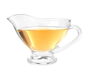 Glass gravy boat with apple vinegar on white background
