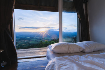 Fototapeta na wymiar Wooden Homestay and beautiful mountains view in morning at Phu Langka National Park in Phayao Province, Thailand.