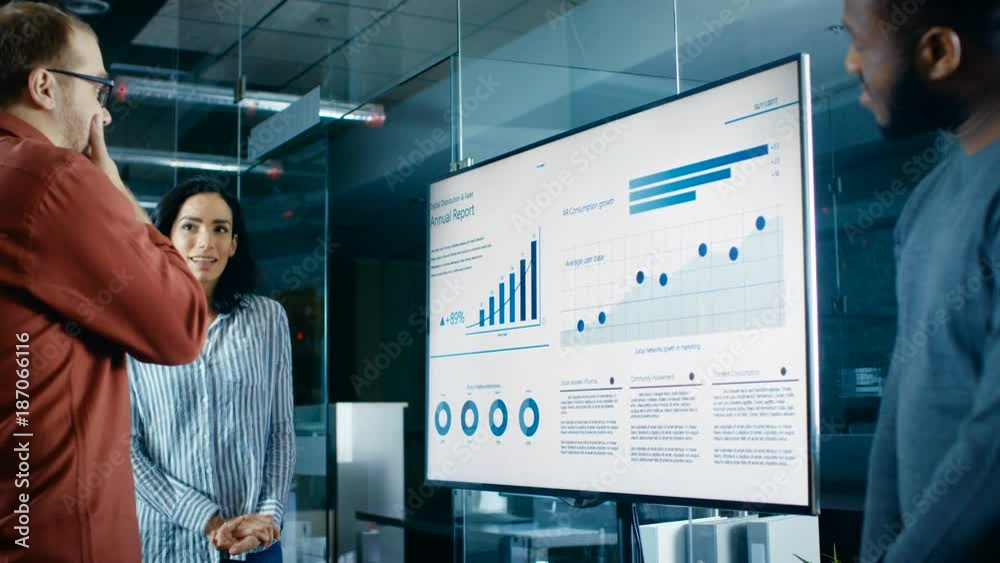 Poster diverse team of business workers in conference room have discussion about statistics and graphs show