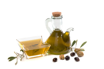 Green and black olives with olive oil bottle