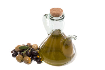 Green and black olives with olive oil bottle