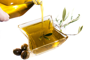 Pouring olive oil in container