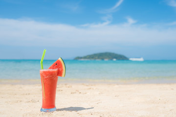 Fototapeta na wymiar Watermelon cocktail on blue tropical summer beach in Phuket, Thailand. Summer, Vacation, Travel and Holiday concept.