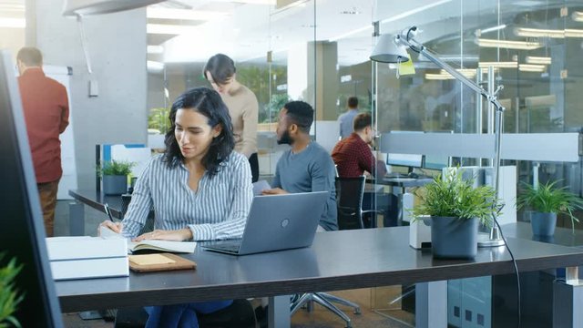 Time-Lapse of the Working Day of a Beautiful Hispanic Businesswoman. She Works in a Busy International Office where Diverse Team of Talented Young People Work on Laptops, Have Meetings, Discussions.