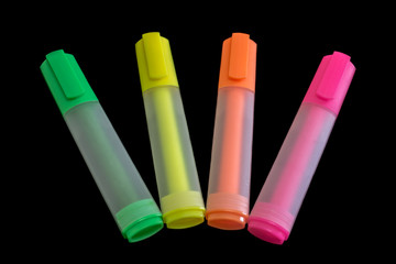 Multicolored highlighters isolated on black background, Highlighter to highlight text, study tools