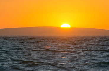 Golden sunset and ocean horizon