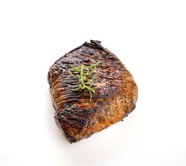 grilled steak with rosemary on a white background