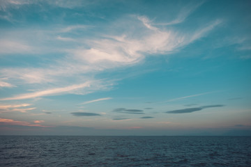 Fototapeta premium Image of sea or ocean with beautiful blue sky background in the evening time