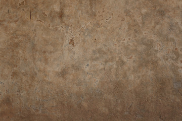 A yellowish mottled wall background