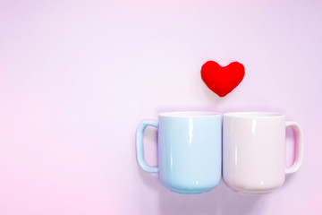 Top view of flat lay decoration Romantic, St valentine's day concept with pin hearts and cups or mug  on pink background and copy space.