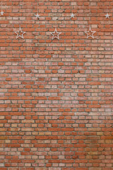 A red brick wall and  star's lamp ornament