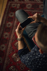 Man using phone at home.