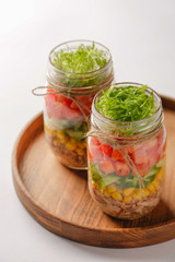 Fototapeta na wymiar Healthy Homemade Mason Jar Salad with Tuna and Veggies - Healthy food, Diet, Detox, Clean Eating or Vegetarian concept