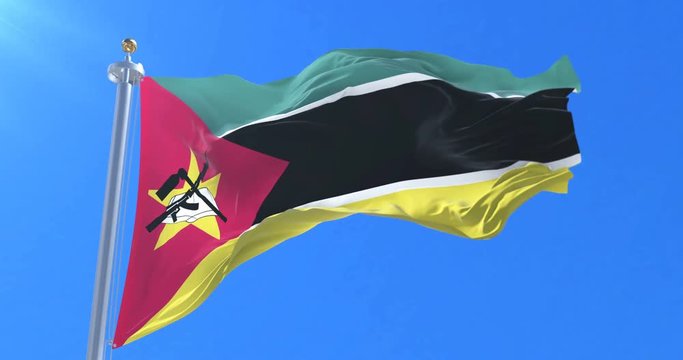 Flag of Mozambique waving at wind in slow in blue sky, loop