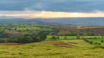 Fototapeta na wymiar View over the landscape of the Brecon Beacons National Park on a cloudy day, seen from Hay Bluff car park in the Black Mountains, Powys, Wales, UK