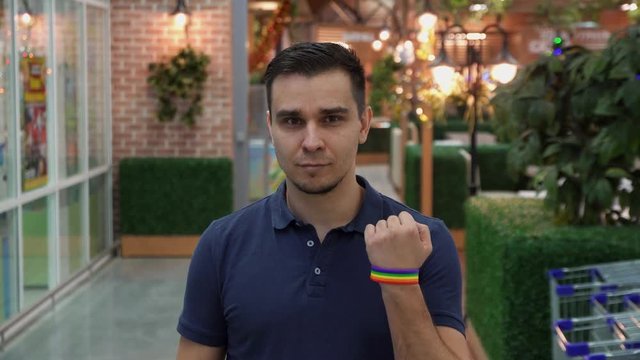 the young man demonstrates the LGBT attribute