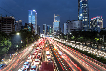 Fototapeta na wymiar Traffic light trails in the heart of Jakarta business district in Indonesia capital city.