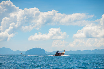 motor wooden Thai boat in the Andaman Sea in sunny weather, Thailand
