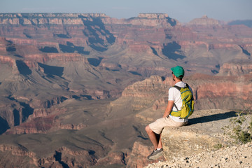 Tourist with backpack at Grand Canyon