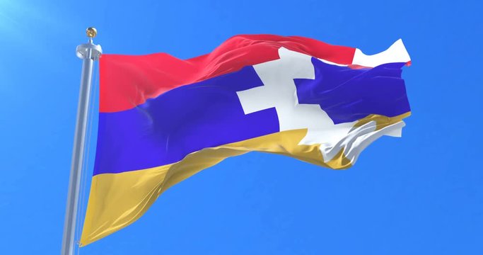 Flag of the Republic of Artsakh waving at wind in slow in blue sky, loop