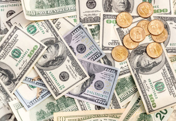 US coins on background of dollars. Top view. Business background.