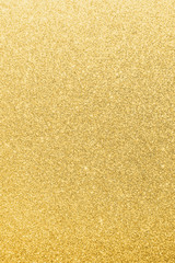 Gold glitter texture background of brilliant yellow metallic golden Christmas holiday decoration...
