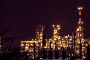 Fototapeta premium an oil plant view with lights at night