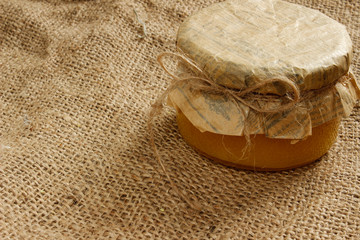 bank with honey on burlap. Side view