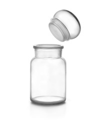 Empty glass bottle and cap floating against white background.
