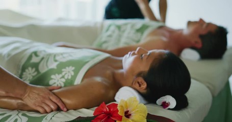 Couple relaxing enjoying massage together at the spa - Powered by Adobe