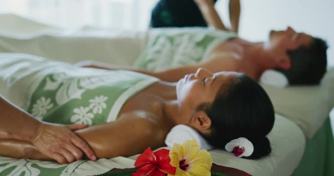 Couple relaxing enjoying massage together at the spa