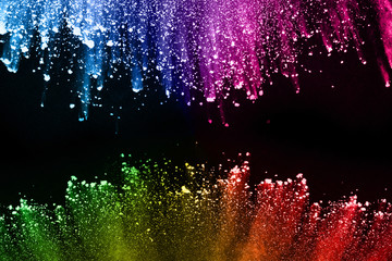 abstract colored dust explosion on a black background.abstract powder splatted background,Freeze...