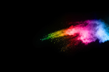 abstract colored dust explosion on a black background.abstract powder splatted background,Freeze motion of color powder exploding/throwing color powder, multicolored glitter texture.