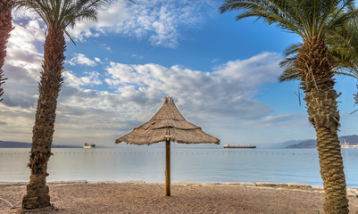 Public sandy beach in Eilat - famous resort and recreation city in Israel