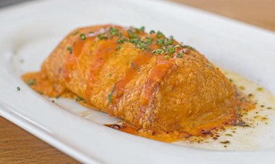 Crispy crepe with cod, prawns and béchamel sauce.