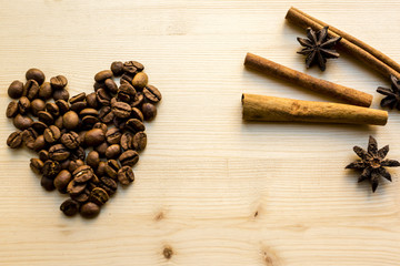 Cinnamon, Anise and coffee  like a heart.  The concept for a romantic morning, Valentine's Day, birthdays. Romantic artistic image.