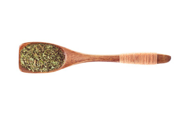 spice dried mint in  wooden spoon isolated on a white background, top view