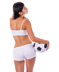 Young beautiful woman in white fitness clothing