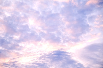Evening sky with violet and yellow clouds