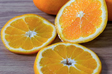 Oranges healthy fruit is placed on wooden floor.
