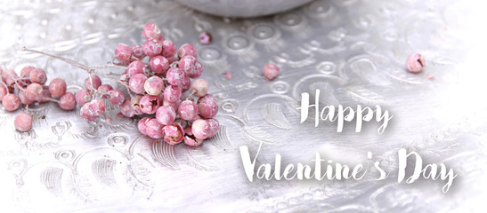 Obraz na płótnie Canvas happy valentine's day pink berries on silver plate