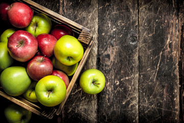 box with fresh red and green apples.