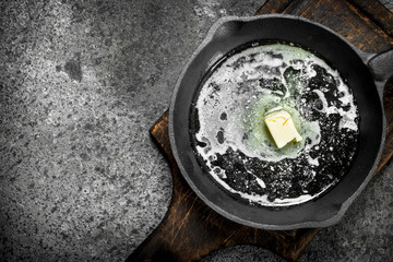 Butter in an old pan.