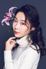 Attractive asian woman on isolated background