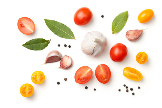 Tomatoes, Garlic, Bay Leaves and Peppercorn Isolated on White Background