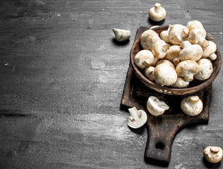 Fresh mushrooms on the board.